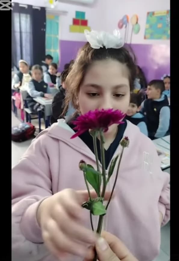 Giving flowers to our third-grade girls makes them shine and glow