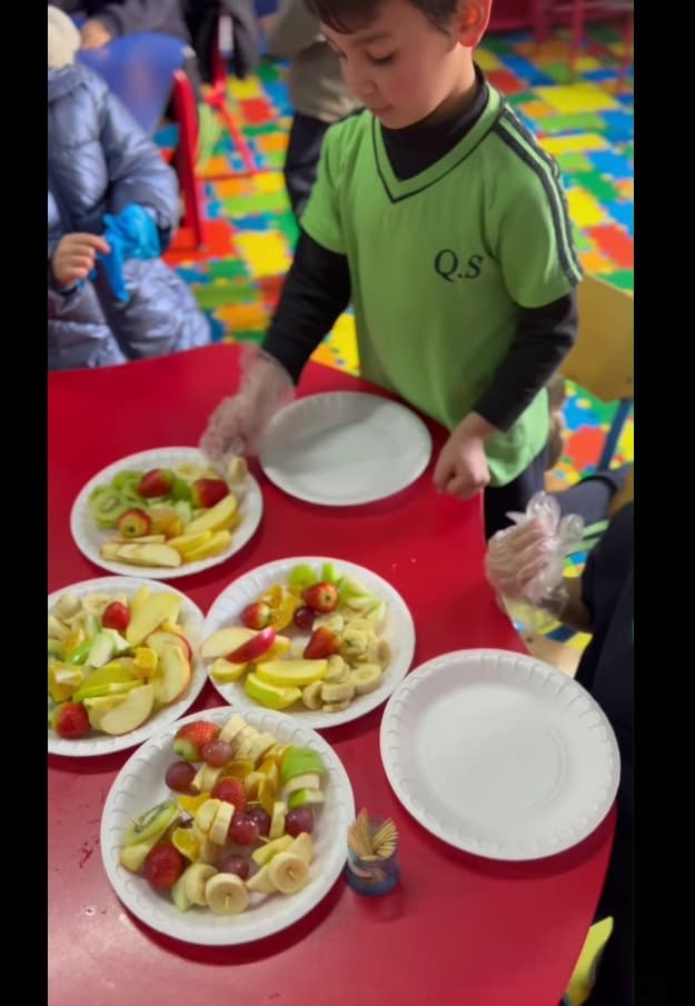 students explored creativity by making shapes with fruits