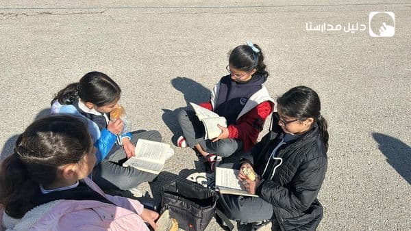 Some fourth-graders took a break from playtime and hung out with a book full of English stories